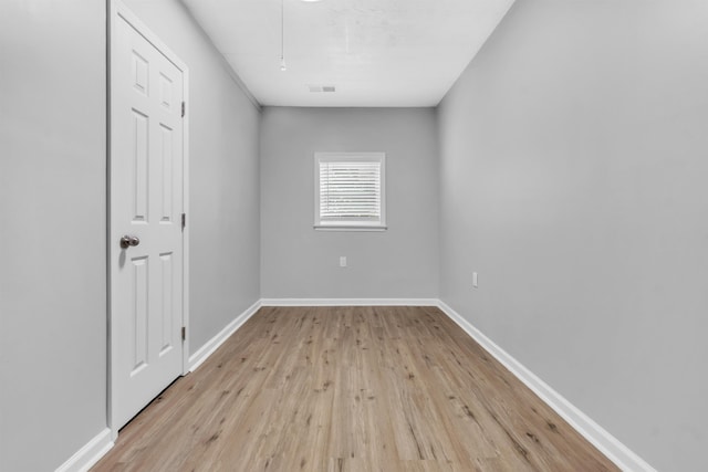 5315 Sleepy Oak Cv, Memphis, TN 38141 - unfurnished bedroom with light wood finished floors, baseboards, and attic access