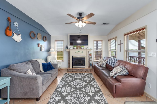 1730 Catfish Ln, Crump, TN 38327 - living area with lofted ceiling, a ceiling fan, a fireplace with raised hearth, and light tile patterned floors