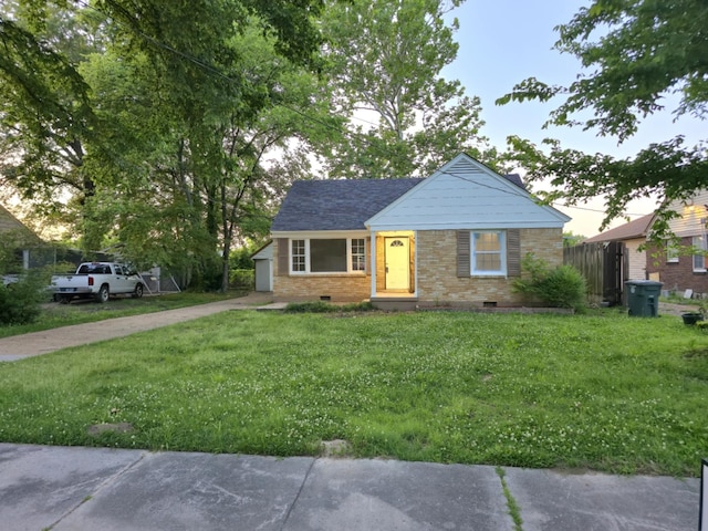 4078 Burrow Ave, Memphis, TN 38128 - view of front of home with crawl space, a front yard, brick siding, and driveway