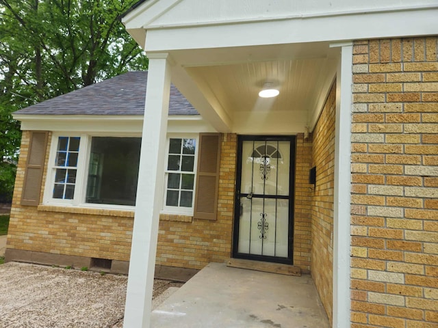 4078 Burrow Ave, Memphis, TN 38128 - view of exterior entry featuring brick siding, a shingled roof, and crawl space