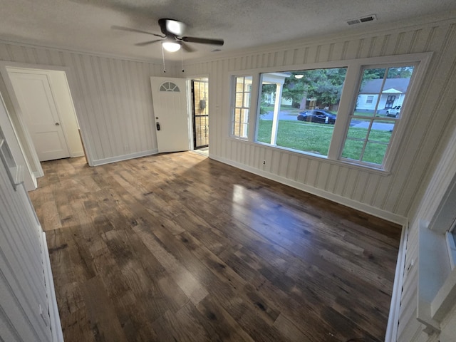 4078 Burrow Ave, Memphis, TN 38128 - empty room featuring wood finished floors, a ceiling fan, healthy amount of natural light, crown molding, and a textured ceiling