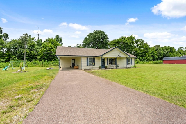 59 Crosswinds Cv, Henning, TN 38041 - ranch-style home featuring a front lawn, driveway, a playground, a carport, and covered porch