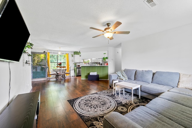 59 Crosswinds Cv, Henning, TN 38041 - living room featuring ceiling fan, dark wood finished floors, and a textured ceiling