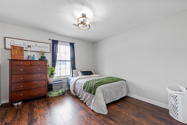 59 Crosswinds Cv, Henning, TN 38041 - bedroom with wood finished floors, baseboards, and a textured ceiling