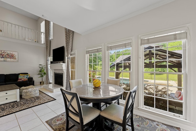 895 Joe Dr, Collierville, TN 38017 - tiled dining area with a high end fireplace and crown molding