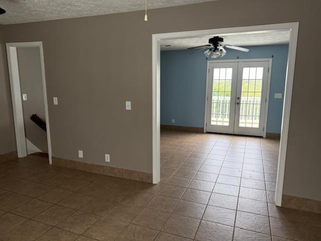 135 Lapa Ln, Clifton, TN 38425 - tiled empty room featuring a ceiling fan, a textured ceiling, french doors, and baseboards
