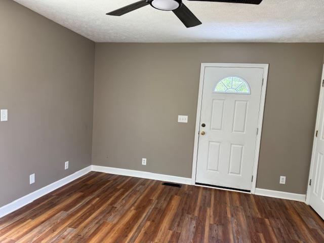 135 Lapa Ln, Clifton, TN 38425 - entrance foyer with ceiling fan, baseboards, wood finished floors, and a textured ceiling