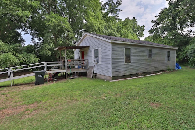 69 Crutcher Lake Rd, Henning, TN 38041 - view of side of property with a lawn, a wooden deck, and cooling unit