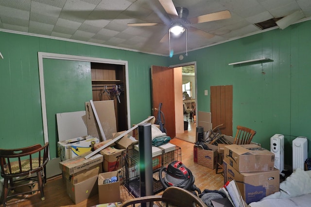 69 Crutcher Lake Rd, Henning, TN 38041 - bedroom with wood finished floors, a closet, ornamental molding, and ceiling fan