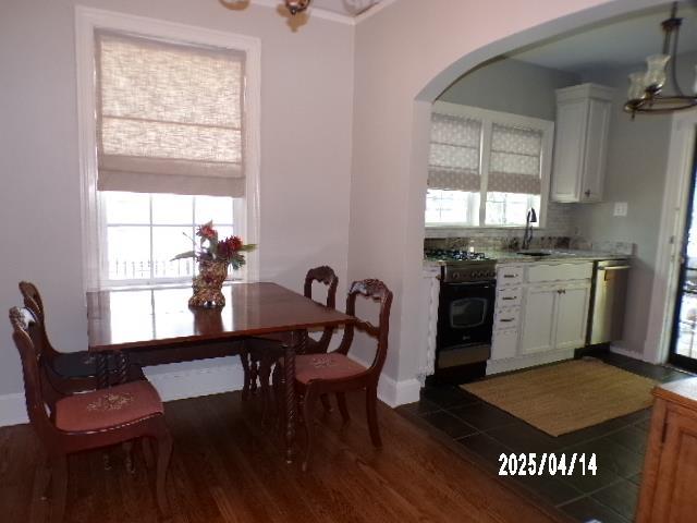 400 S Reese St, Memphis, TN 38111 - dining space featuring arched walkways, dark wood finished floors, plenty of natural light, and baseboards