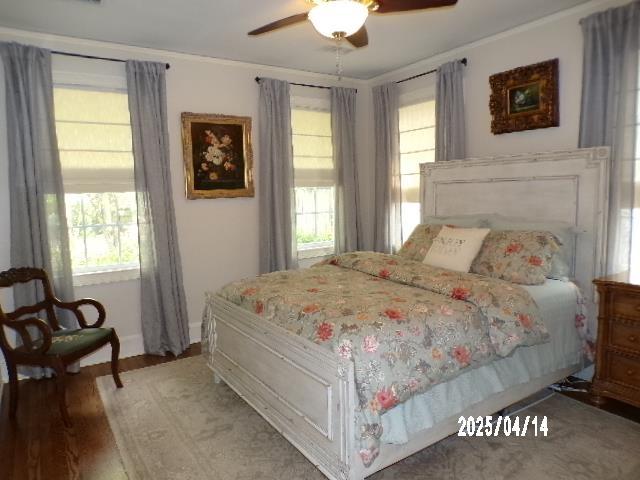 400 S Reese St, Memphis, TN 38111 - bedroom with multiple windows, ornamental molding, wood finished floors, baseboards, and ceiling fan
