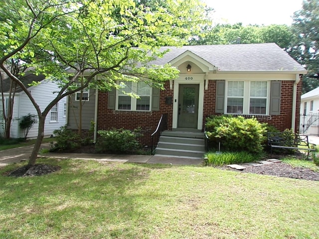 400 S Reese St, Memphis, TN 38111 - bungalow-style home featuring brick siding, a front yard, and roof with shingles