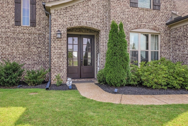 35 Laurel Pointe Cv, Oakland, TN 38060 - doorway to property with french doors, brick siding, and a lawn