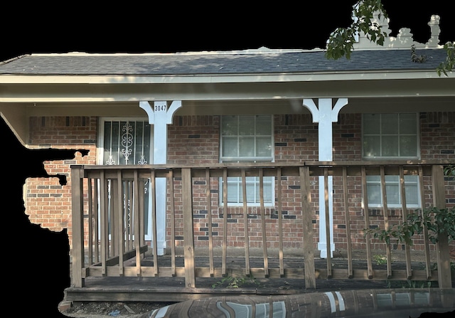 3047 Mcvay Trail Dr, Memphis, TN 38119 - exterior entry at twilight with brick siding, a shingled roof, and covered porch