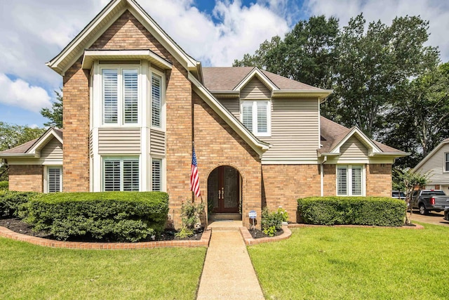 2019 Kostka Ln, Germantown, TN 38139 - view of front of property with a front yard, brick siding, french doors, and a shingled roof