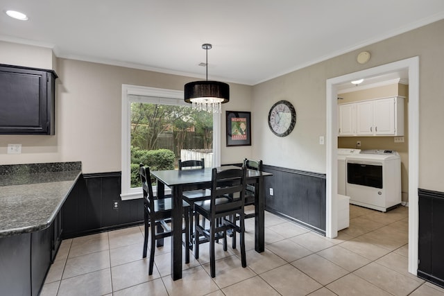 2019 Kostka Ln, Germantown, TN 38139 - dining room with separate washer and dryer, a wainscoted wall, light tile patterned floors, a chandelier, and ornamental molding