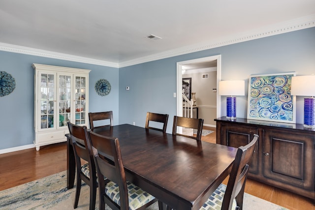 2019 Kostka Ln, Germantown, TN 38139 - dining area featuring wood finished floors, ornamental molding, and baseboards
