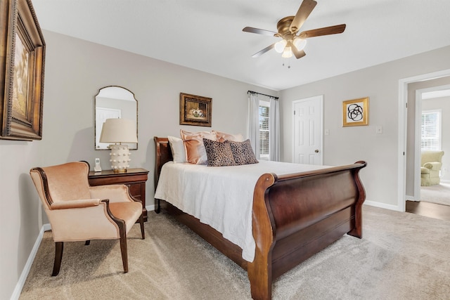7255 Barnstable Dr, Memphis, TN 38125 - bedroom with light carpet, multiple windows, baseboards, and a ceiling fan