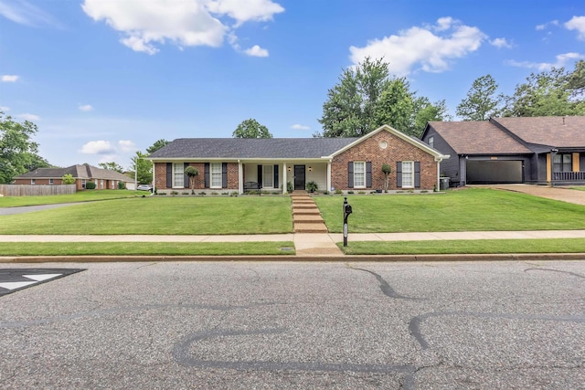 7255 Barnstable Dr, Memphis, TN 38125 - single story home with brick siding, a front yard, and a porch