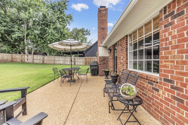 7255 Barnstable Dr, Memphis, TN 38125 - view of patio with outdoor dining space and a grill
