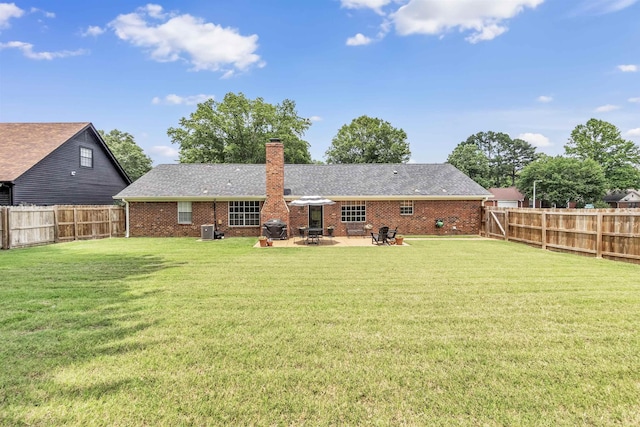7255 Barnstable Dr, Memphis, TN 38125 - back of property featuring a chimney, brick siding, a patio, and a shingled roof