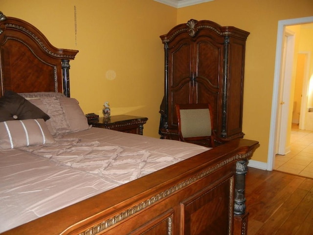 197 Walnut Gardens Dr, Memphis, TN 38018 - bedroom featuring wood finished floors, baseboards, and ornamental molding