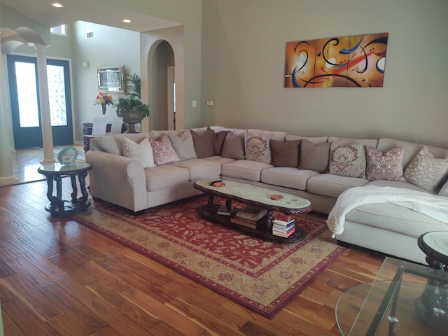197 Walnut Gardens Dr, Memphis, TN 38018 - living room with arched walkways, decorative columns, wood finished floors, and recessed lighting