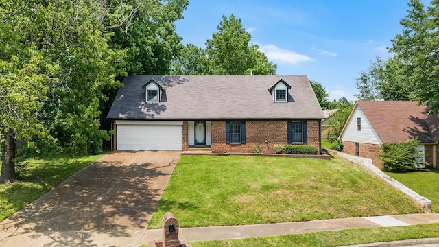 5424 Peyton Randolph St, Bartlett, TN 38134 - new england style home with concrete driveway, brick siding, a front yard, and a shingled roof