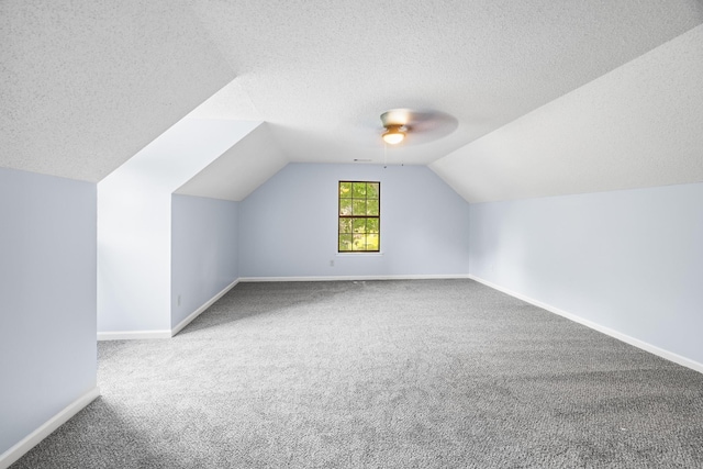 5424 Peyton Randolph St, Bartlett, TN 38134 - bonus room with carpet floors, a textured ceiling, a ceiling fan, vaulted ceiling, and baseboards