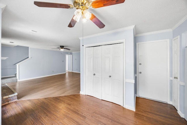 5424 Peyton Randolph St, Bartlett, TN 38134 - unfurnished living room with ceiling fan, wood finished floors, crown molding, baseboards, and a textured ceiling