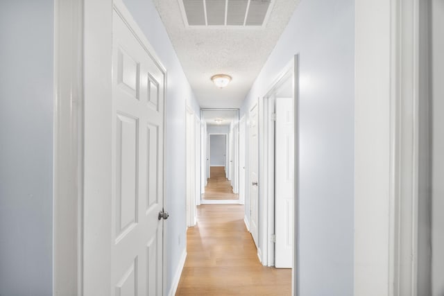 5424 Peyton Randolph St, Bartlett, TN 38134 - corridor with a textured ceiling, light wood-style flooring, and baseboards