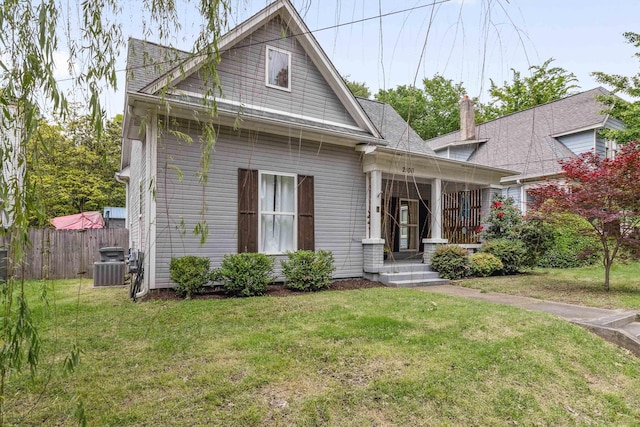2106 Higbee Ave, Memphis, TN 38104 - view of front of property featuring a porch, central AC unit, and a chimney