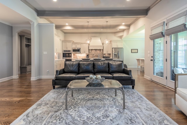 12432 Zapata Cv, Collierville, TN 38017 - living area with beamed ceiling, dark wood-type flooring, arched walkways, baseboards, and recessed lighting