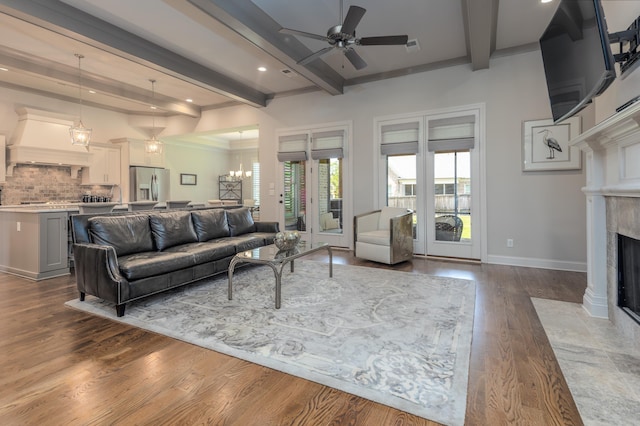 12432 Zapata Cv, Collierville, TN 38017 - living area with a ceiling fan, beam ceiling, a high end fireplace, wood finished floors, and baseboards