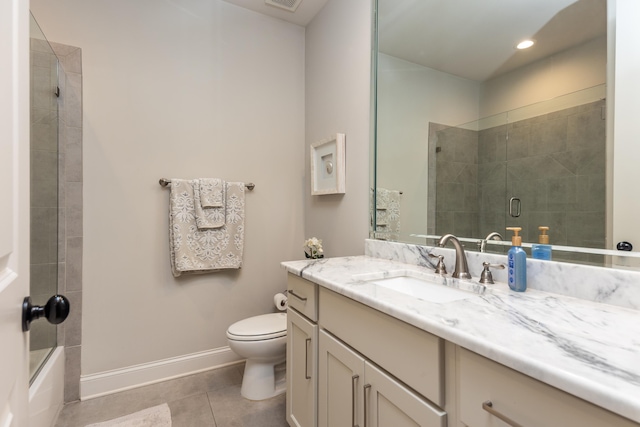 12432 Zapata Cv, Collierville, TN 38017 - full bath with vanity, toilet, tile patterned floors, baseboards, and recessed lighting