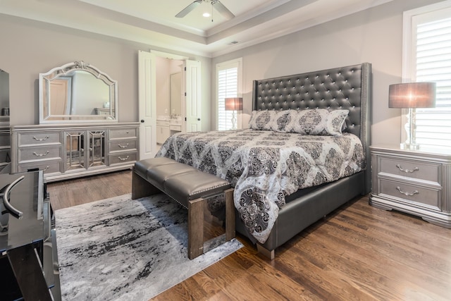 12432 Zapata Cv, Collierville, TN 38017 - bedroom featuring wood finished floors, ornamental molding, a tray ceiling, ceiling fan, and ensuite bathroom