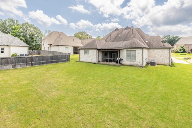 12432 Zapata Cv, Collierville, TN 38017 - rear view of property with cooling unit, brick siding, and a residential view