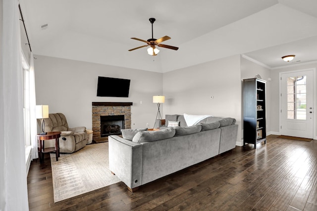 6486 Anglia Valley Dr, Arlington, TN 38002 - living area featuring dark wood finished floors, a ceiling fan, a stone fireplace, baseboards, and crown molding