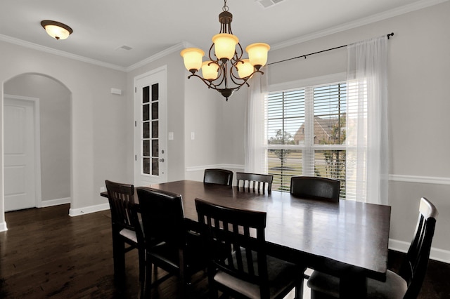 6486 Anglia Valley Dr, Arlington, TN 38002 - dining area with arched walkways, a chandelier, dark wood-style floors, ornamental molding, and baseboards