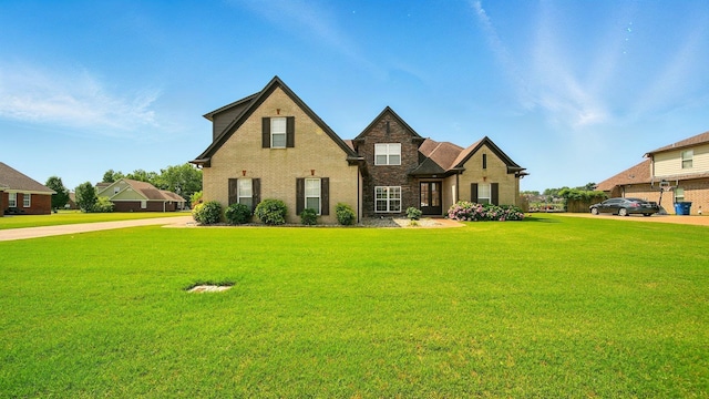 235 Hawthorn Ln, Atoka, TN 38004 - view of front of property featuring brick siding and a front lawn