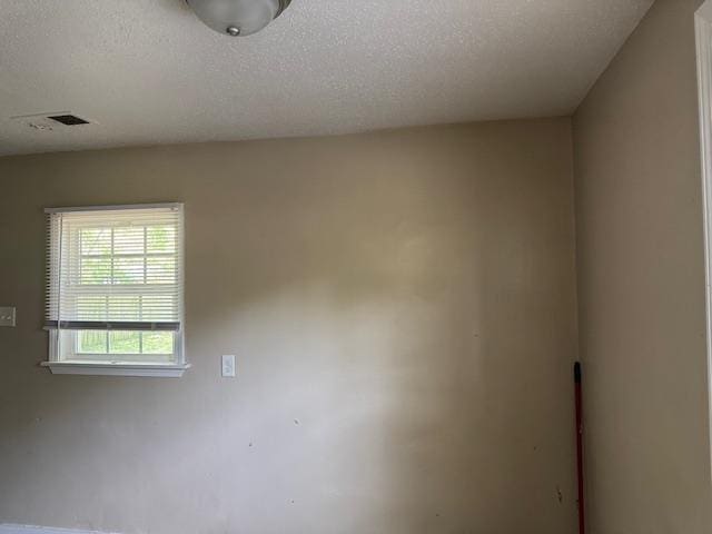 1245 Holliday Ave, Memphis, TN 38122 - empty room with a textured ceiling
