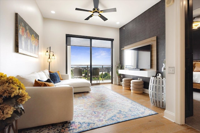 717 Riverside Dr Unit 1104, Memphis, TN 38103 - living room featuring wood finished floors, ceiling fan, recessed lighting, and baseboards
