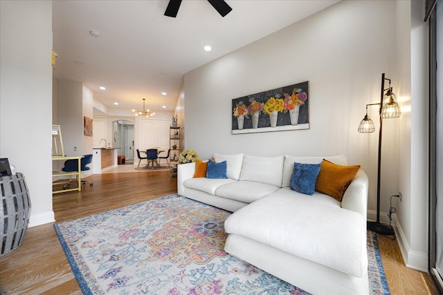 717 Riverside Dr Unit 1104, Memphis, TN 38103 - living room with ceiling fan, recessed lighting, wood finished floors, a chandelier, and baseboards