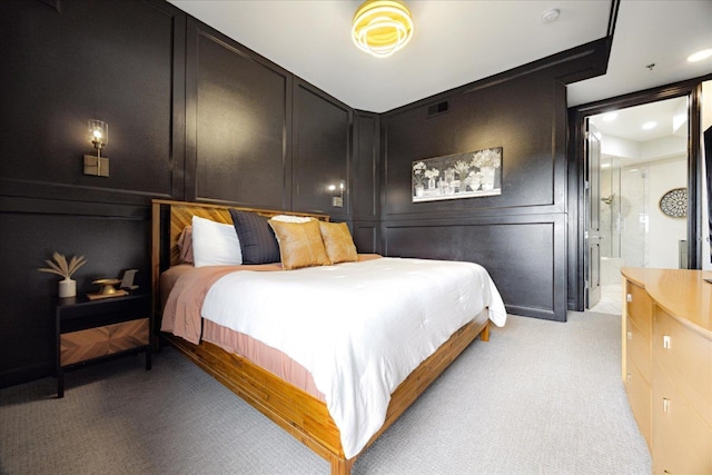 717 Riverside Dr Unit 1104, Memphis, TN 38103 - bedroom with a decorative wall and light carpet