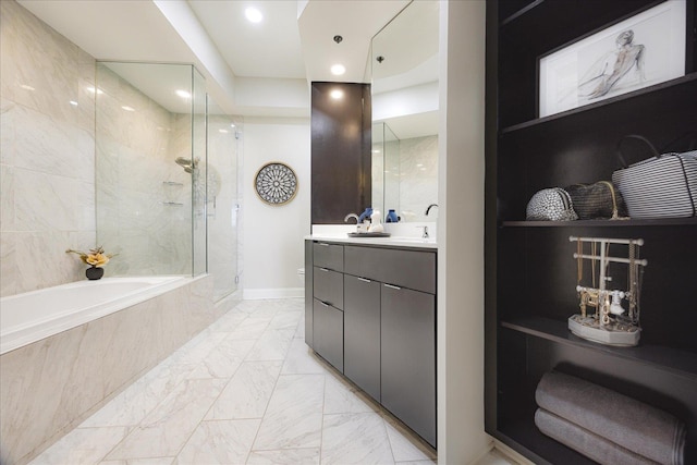 717 Riverside Dr Unit 1104, Memphis, TN 38103 - bathroom featuring marble finish floors, a tile shower, double vanity, tiled tub, and toilet