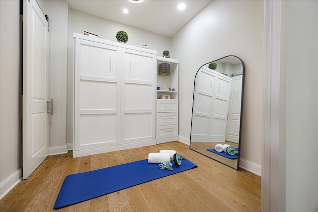 717 Riverside Dr Unit 1104, Memphis, TN 38103 - exercise room with light wood-style floors, baseboards, and recessed lighting