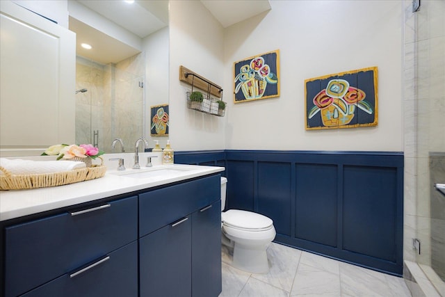 717 Riverside Dr Unit 1104, Memphis, TN 38103 - bathroom with marble look tile flooring, a stall shower, vanity, toilet, and a decorative wall
