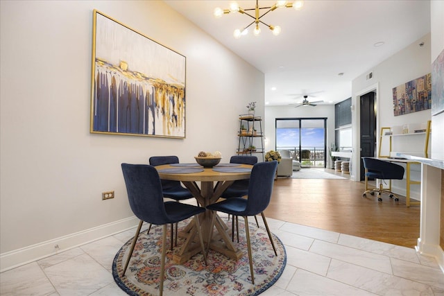 717 Riverside Dr Unit 1104, Memphis, TN 38103 - dining space featuring light marble finish flooring, a chandelier, an office area, and baseboards