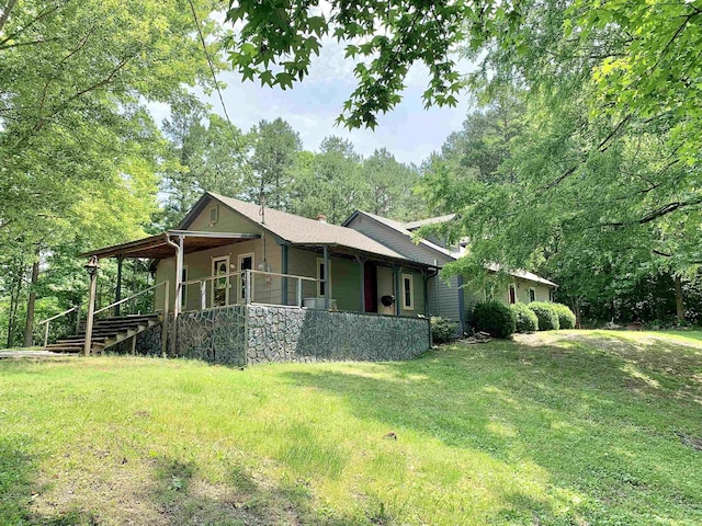 24335 US Highway 64, Hornsby, TN 38044 - view of property exterior with a lawn, a porch, and a chimney