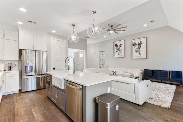 9709 Woodland Brook Ln S, Cordova, TN 38018 - kitchen with appliances with stainless steel finishes, a sink, open floor plan, a ceiling fan, and dark wood-style floors